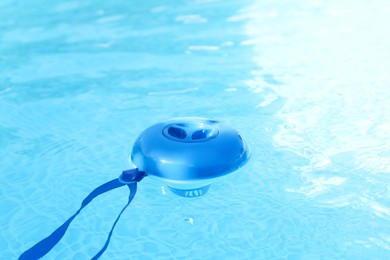 Photo of One robotic cleaner in swimming pool outdoors