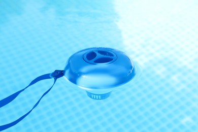 Photo of One robotic cleaner in swimming pool outdoors