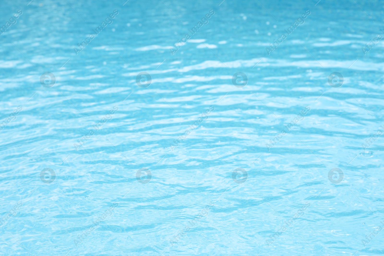 Photo of Clear water in outdoor swimming pool on sunny day