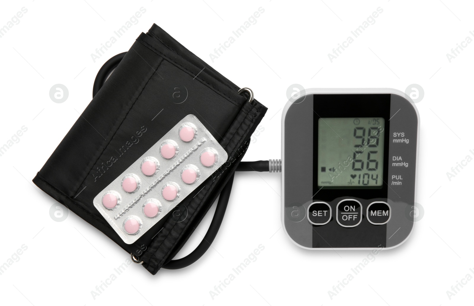 Photo of Blood pressure measuring device and pill blister isolated on white, top view