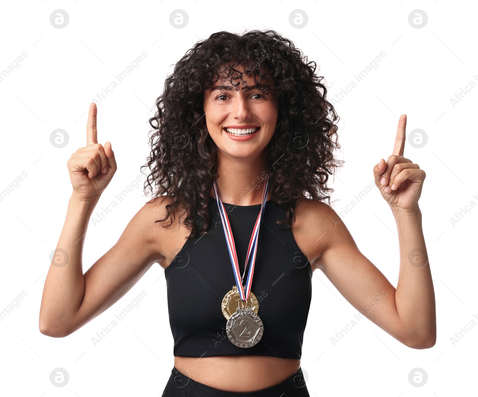 Photo of Happy winner with different medals pointing upwards on white background