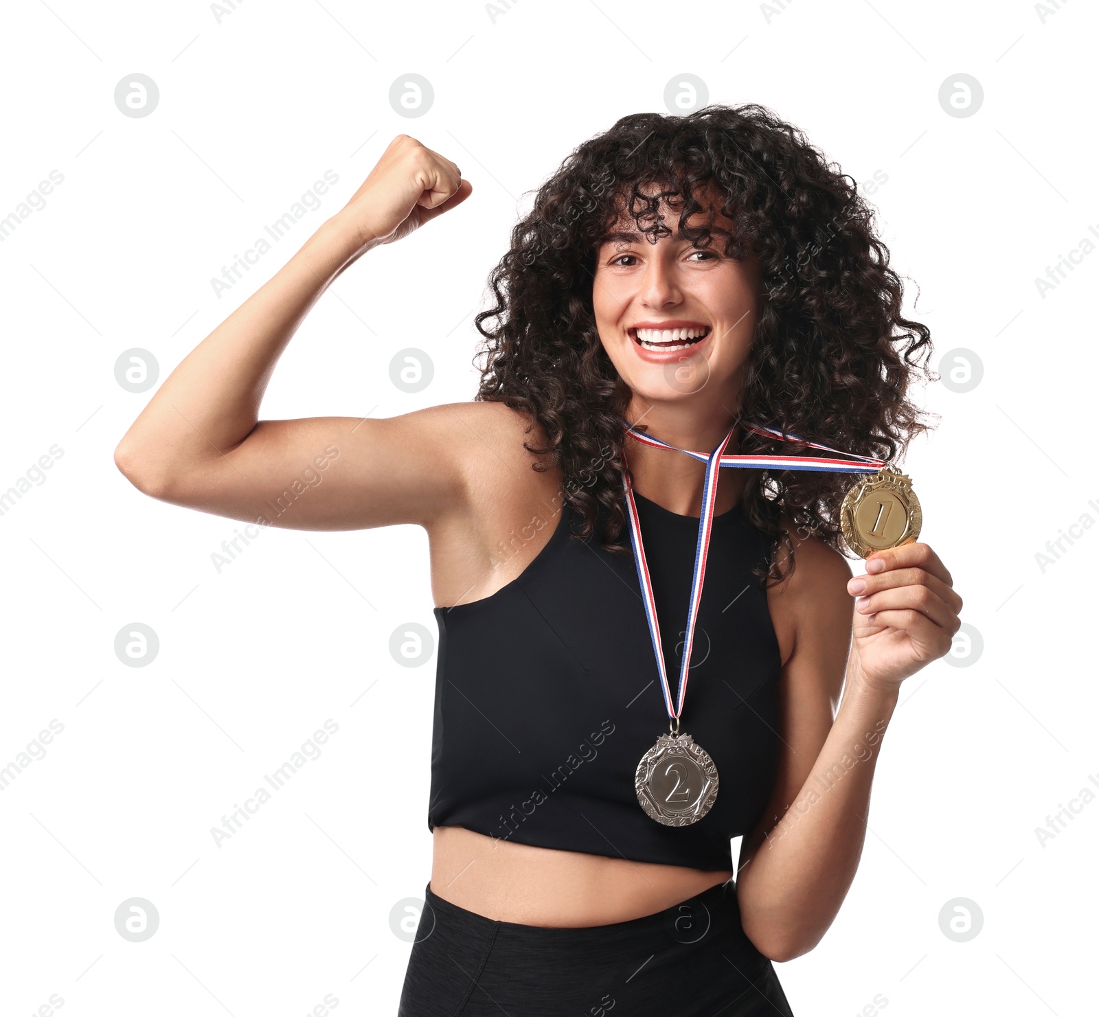 Photo of Happy winner with different medals showing muscles on white background