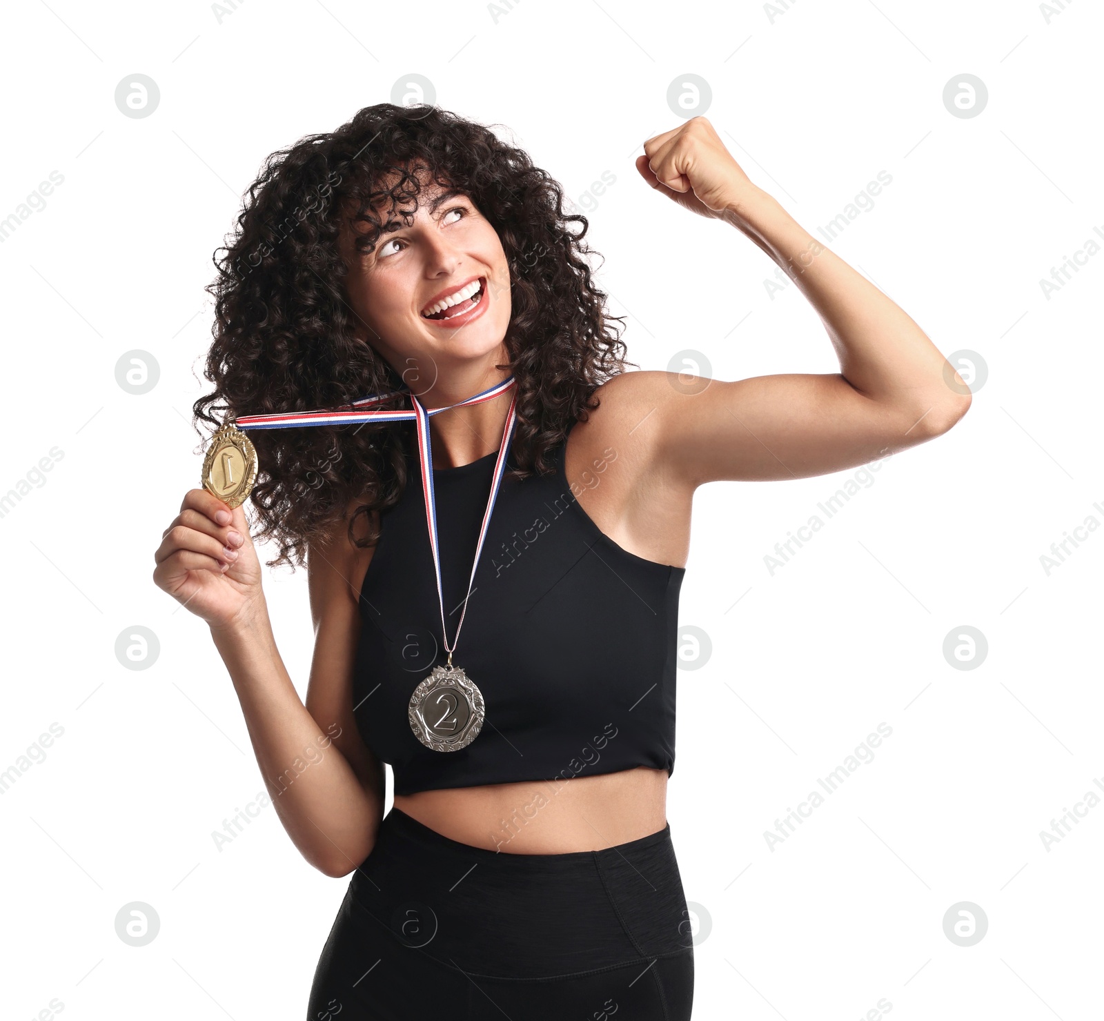 Photo of Happy winner with different medals showing muscles on white background