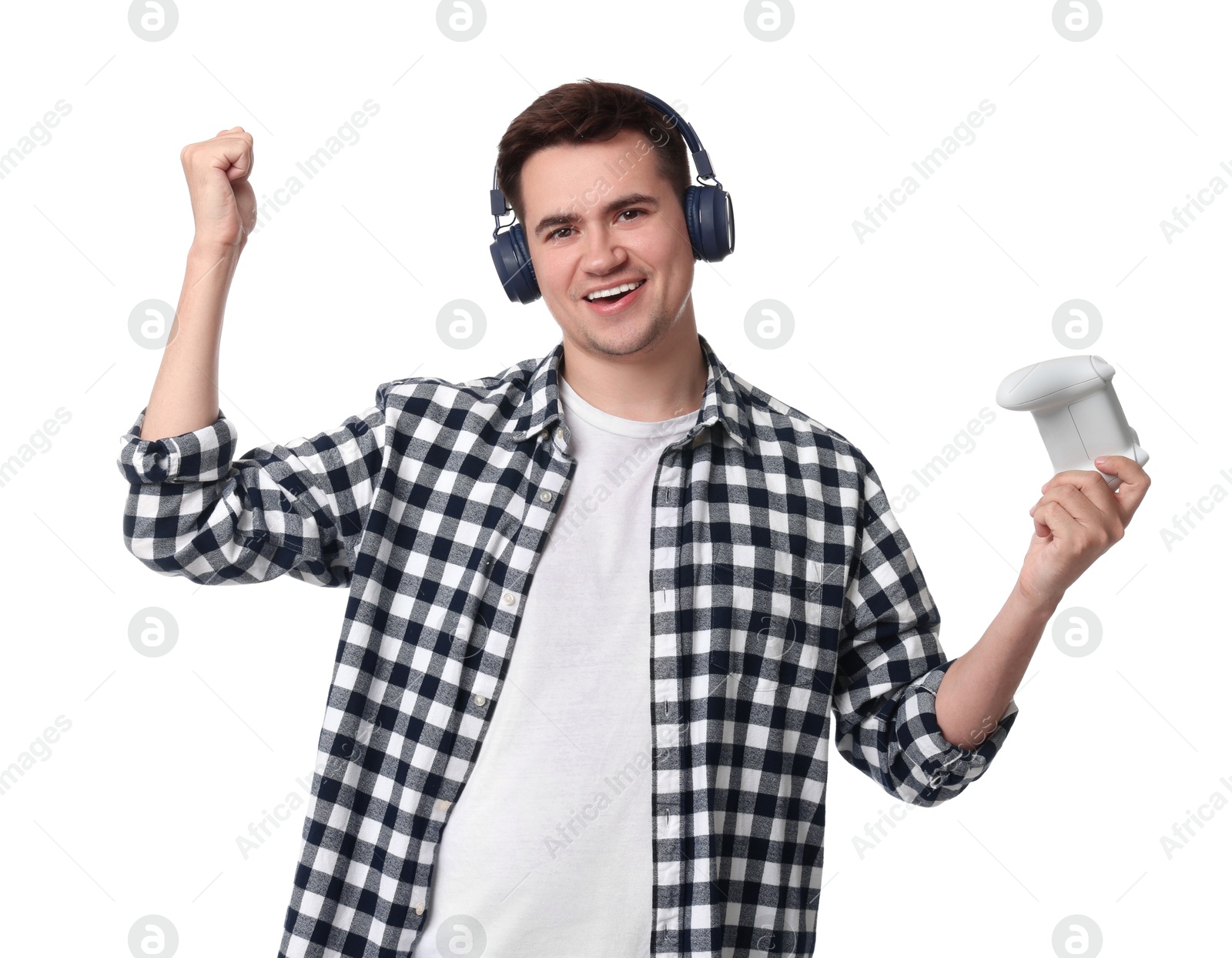 Photo of Happy young man in headphones with controller on white background