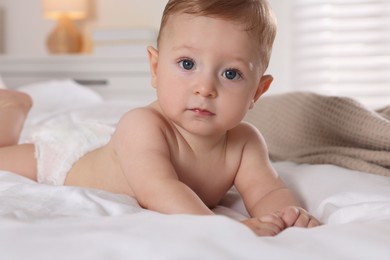 Photo of Cute little baby on bed at home