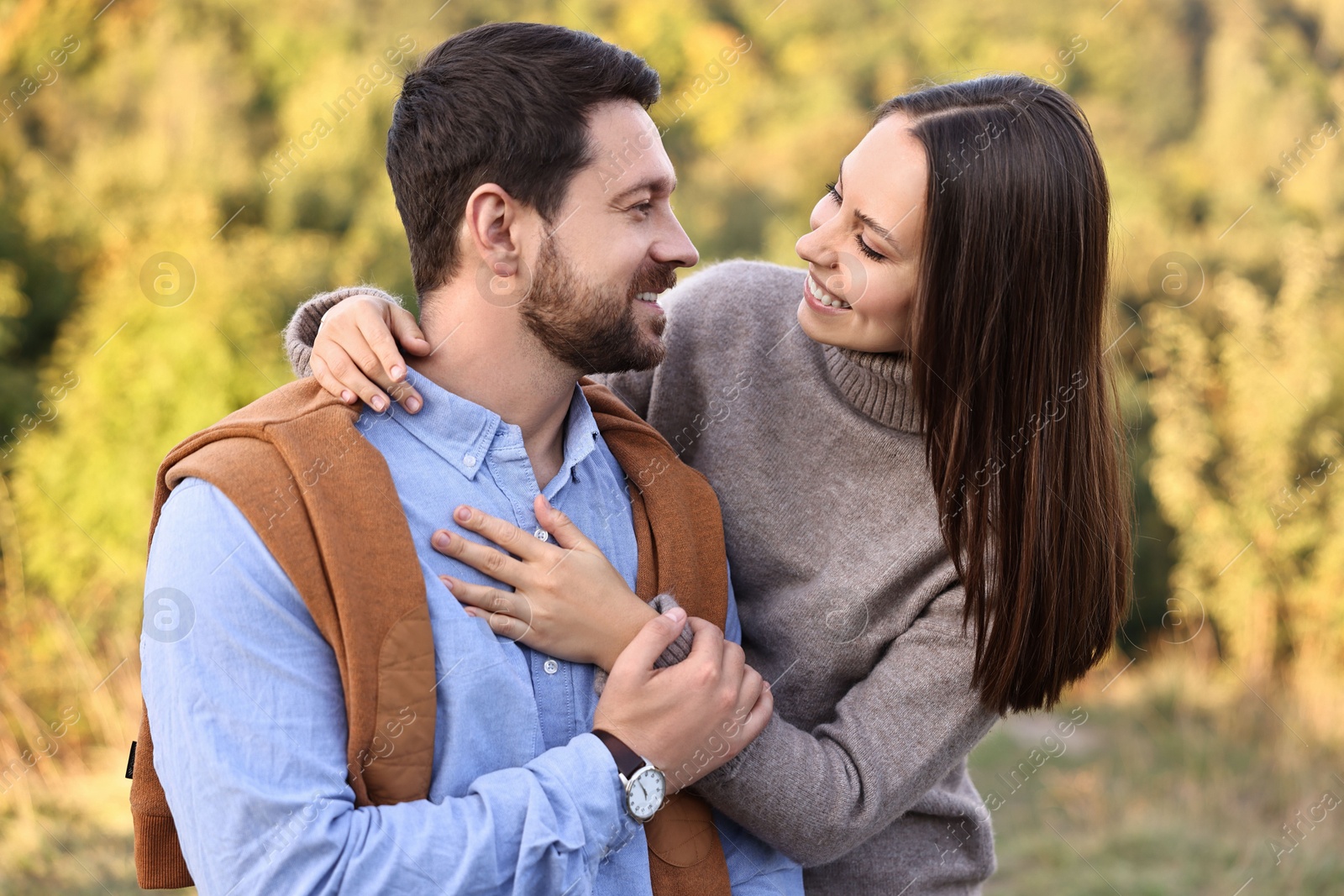 Photo of Beautiful couple spending time together outdoors on autumn day