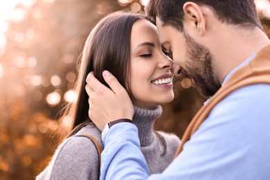 Photo of Beautiful couple spending time together outdoors on autumn day