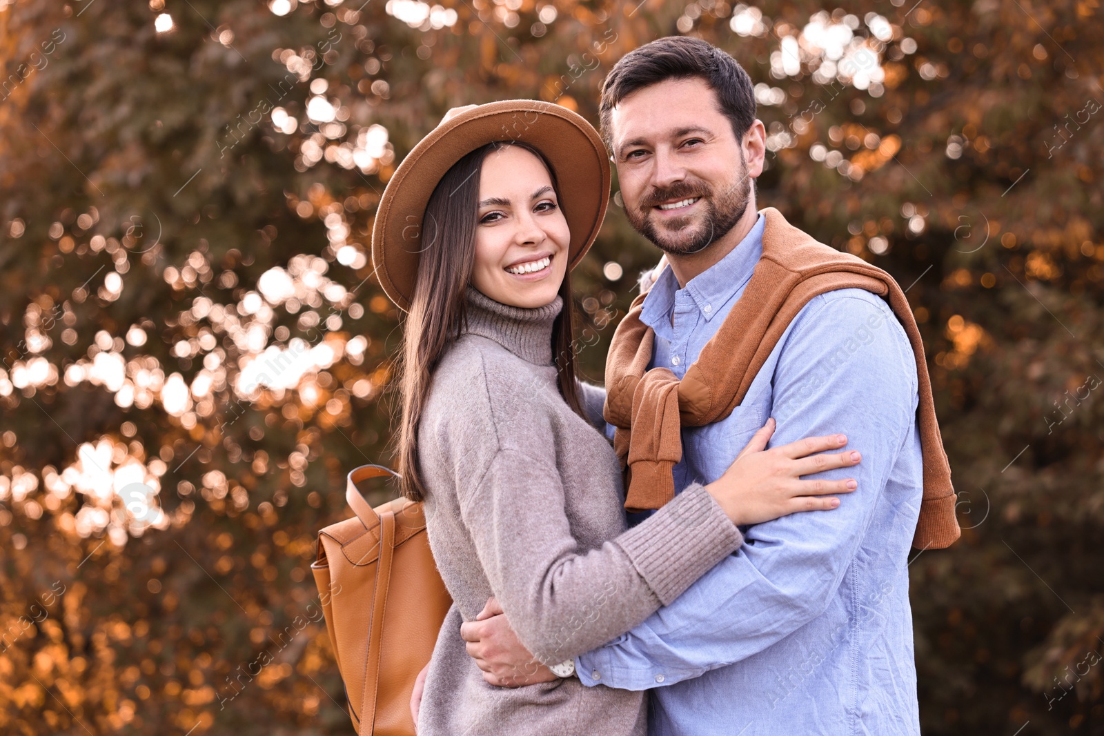 Photo of Beautiful couple spending time together outdoors on autumn day