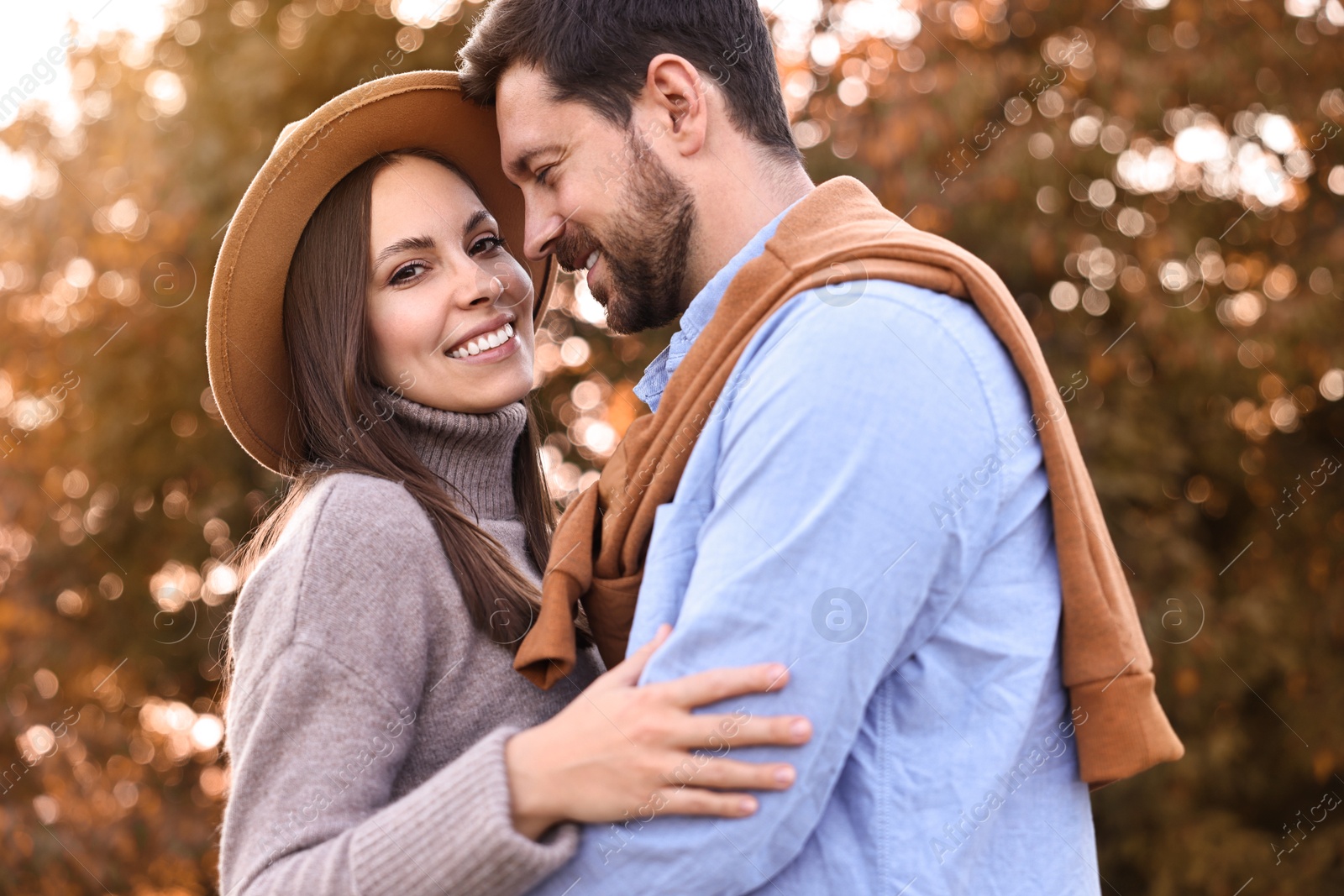 Photo of Beautiful couple spending time together outdoors on autumn day