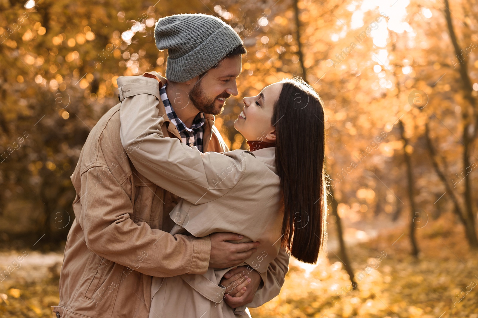 Photo of Beautiful couple spending time in park on autumn day