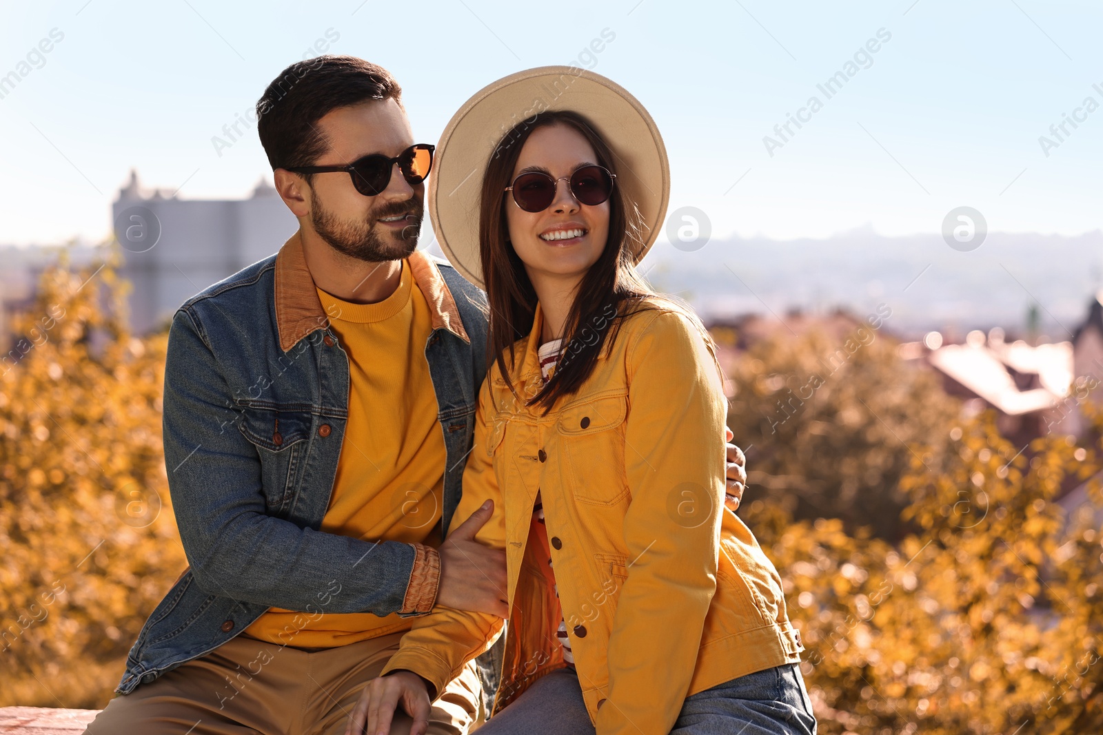 Photo of Beautiful couple in sunglasses outdoors on autumn day