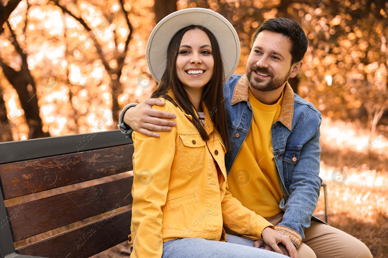 Photo of Beautiful couple spending time together in park on autumn day