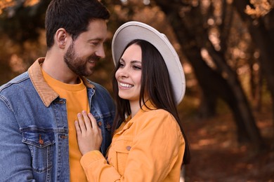 Beautiful couple in park on autumn day