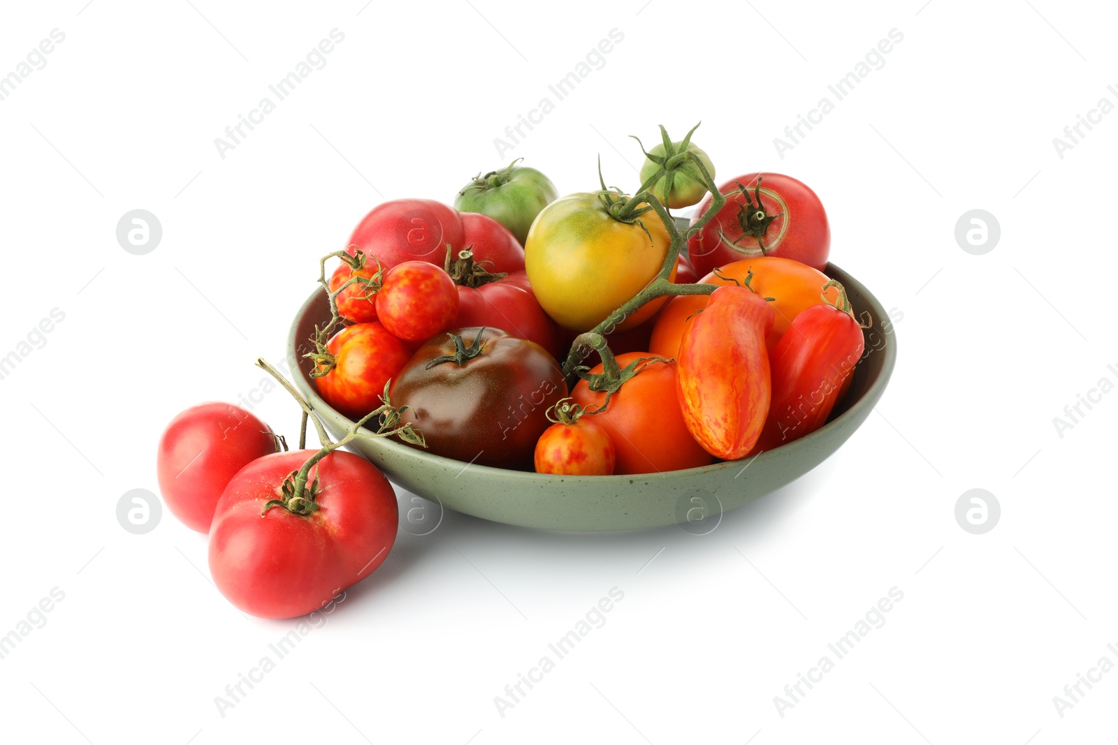 Photo of Different ripe tomatoes in bowl on white background