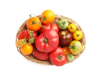 Photo of Different ripe tomatoes in basket isolated on white, top view