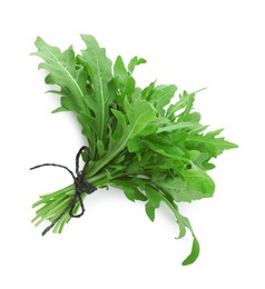 Photo of Bunch of fresh arugula leaves isolated on white, top view