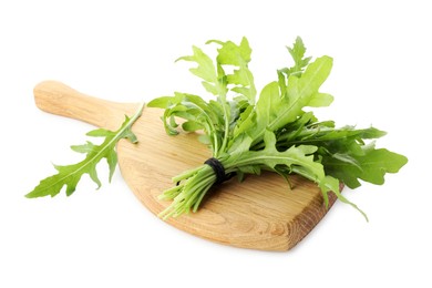 Photo of Bunch of fresh arugula leaves and board isolated on white