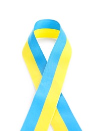 Photo of Ribbon in colors of Ukrainian national flag isolated on white, top view