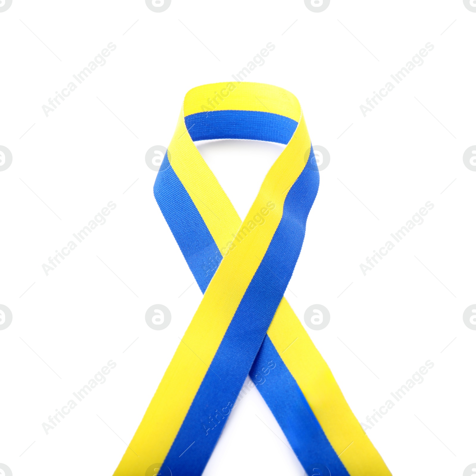 Photo of Ribbon in colors of Ukrainian national flag isolated on white, top view