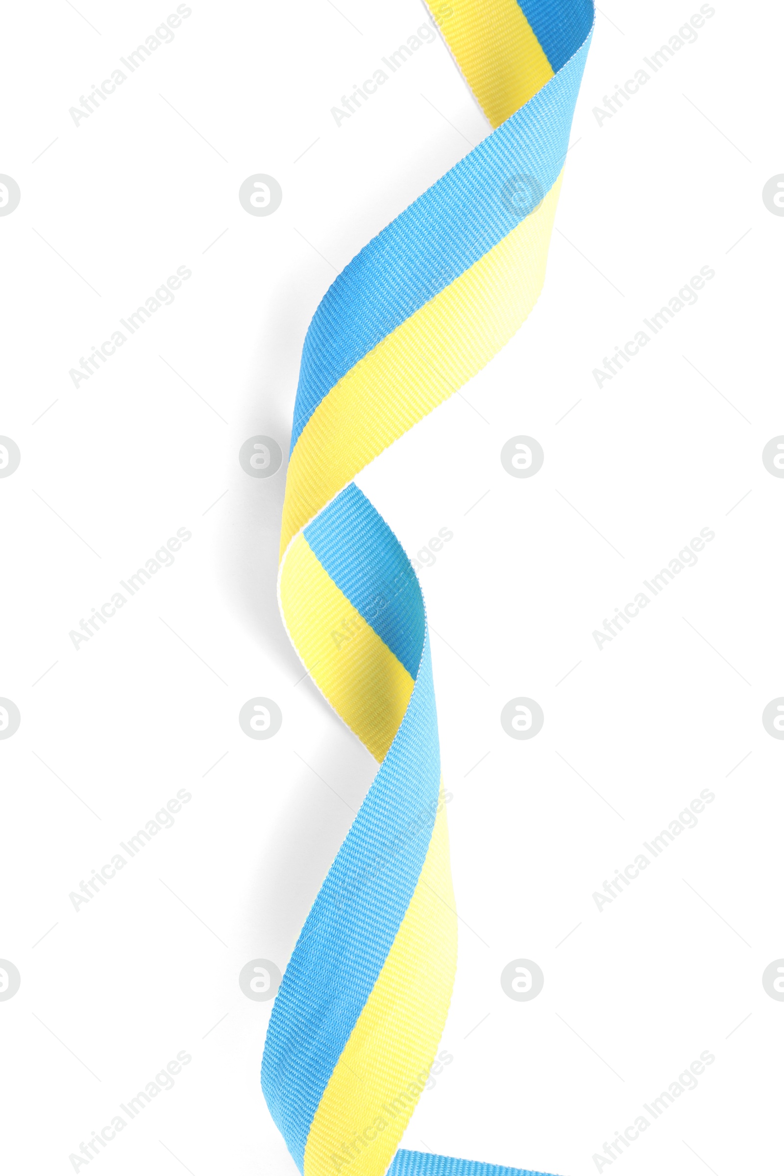 Photo of Ribbon in colors of Ukrainian national flag isolated on white, top view