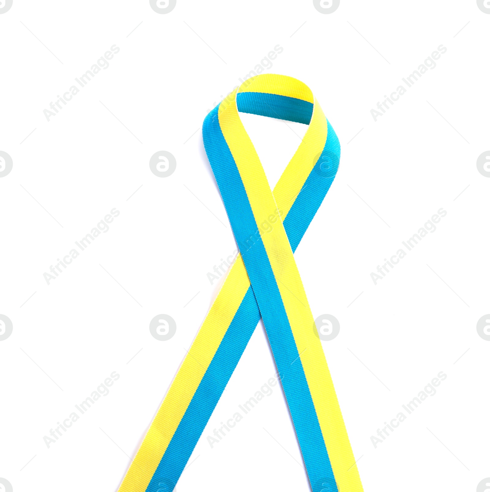 Photo of Ribbon in colors of Ukrainian national flag isolated on white, top view