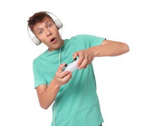 Young man playing video games with controller on white background