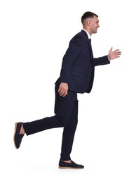 Businessman in suit running on white background