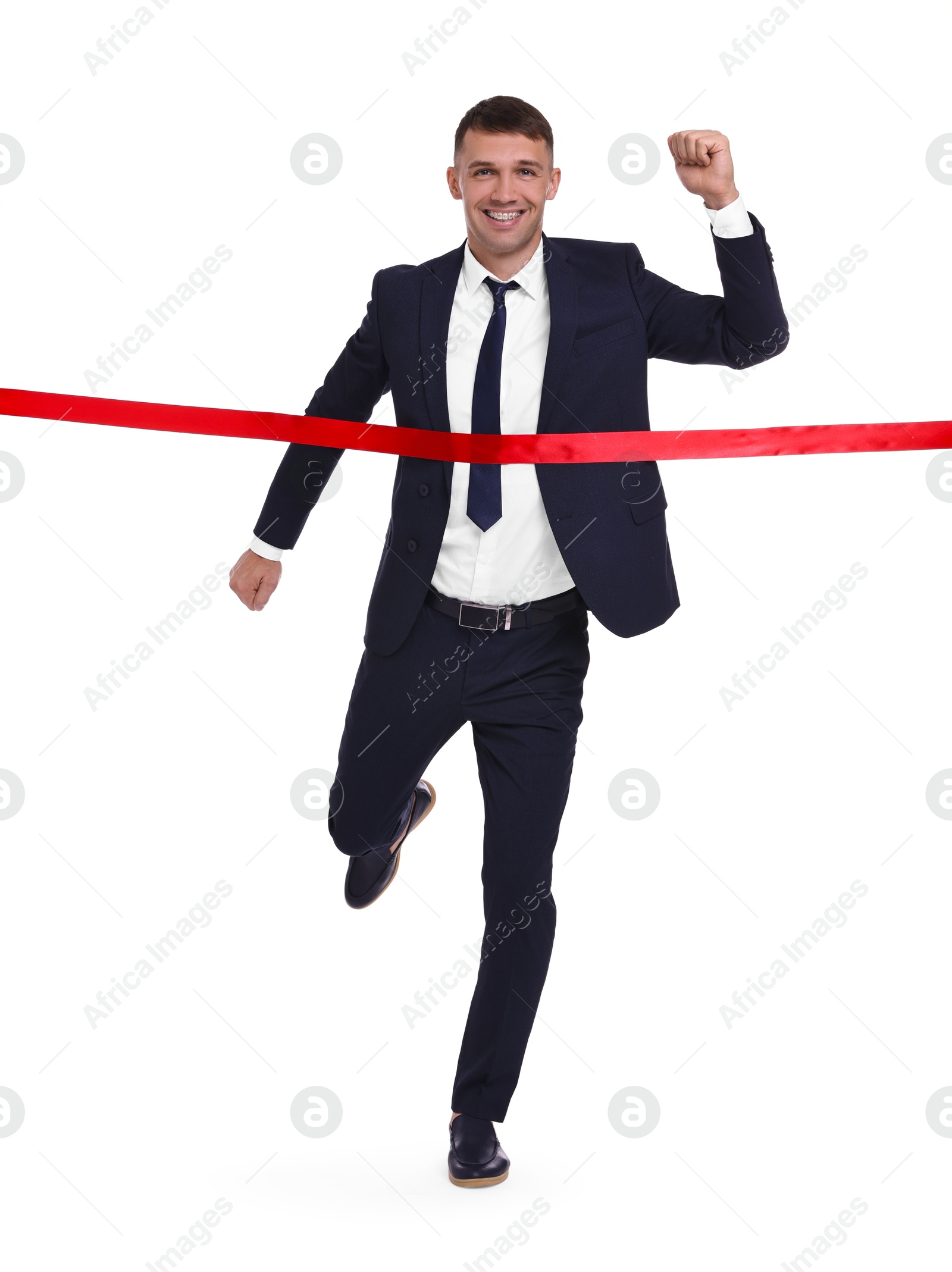 Photo of Businessman in suit crossing red finish line on white background