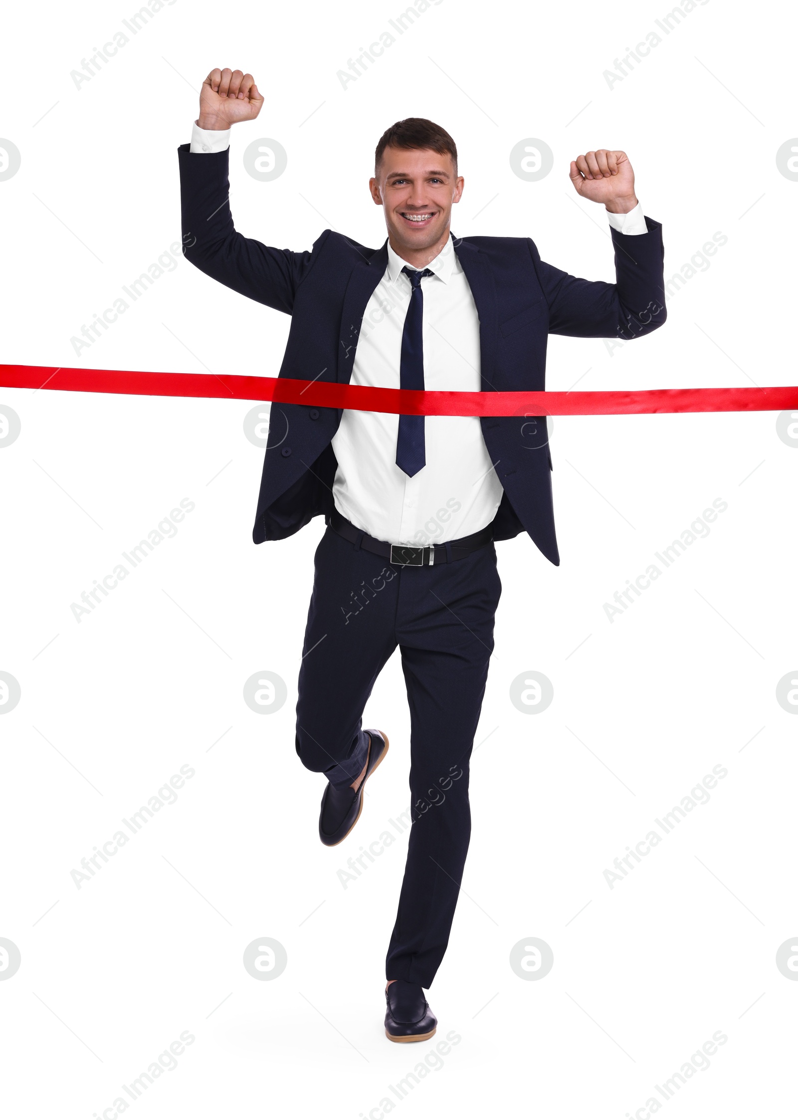 Photo of Businessman in suit crossing red finish line on white background