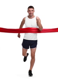 Photo of Man in sportswear crossing red finish line on white background