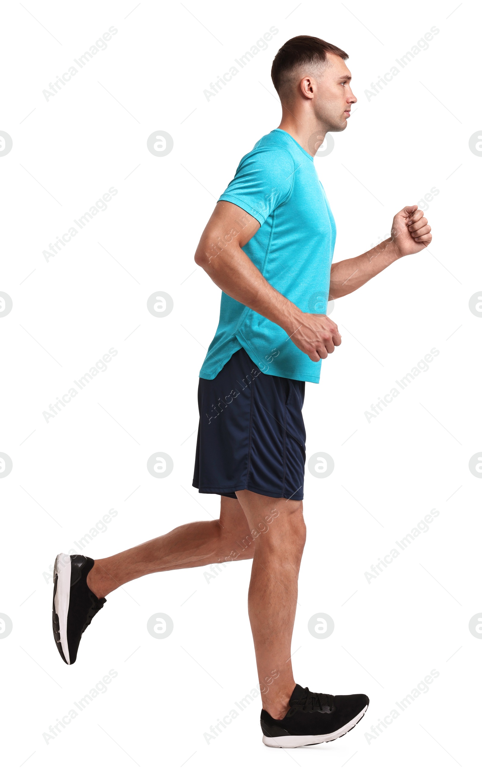 Photo of Man in sportswear running on white background