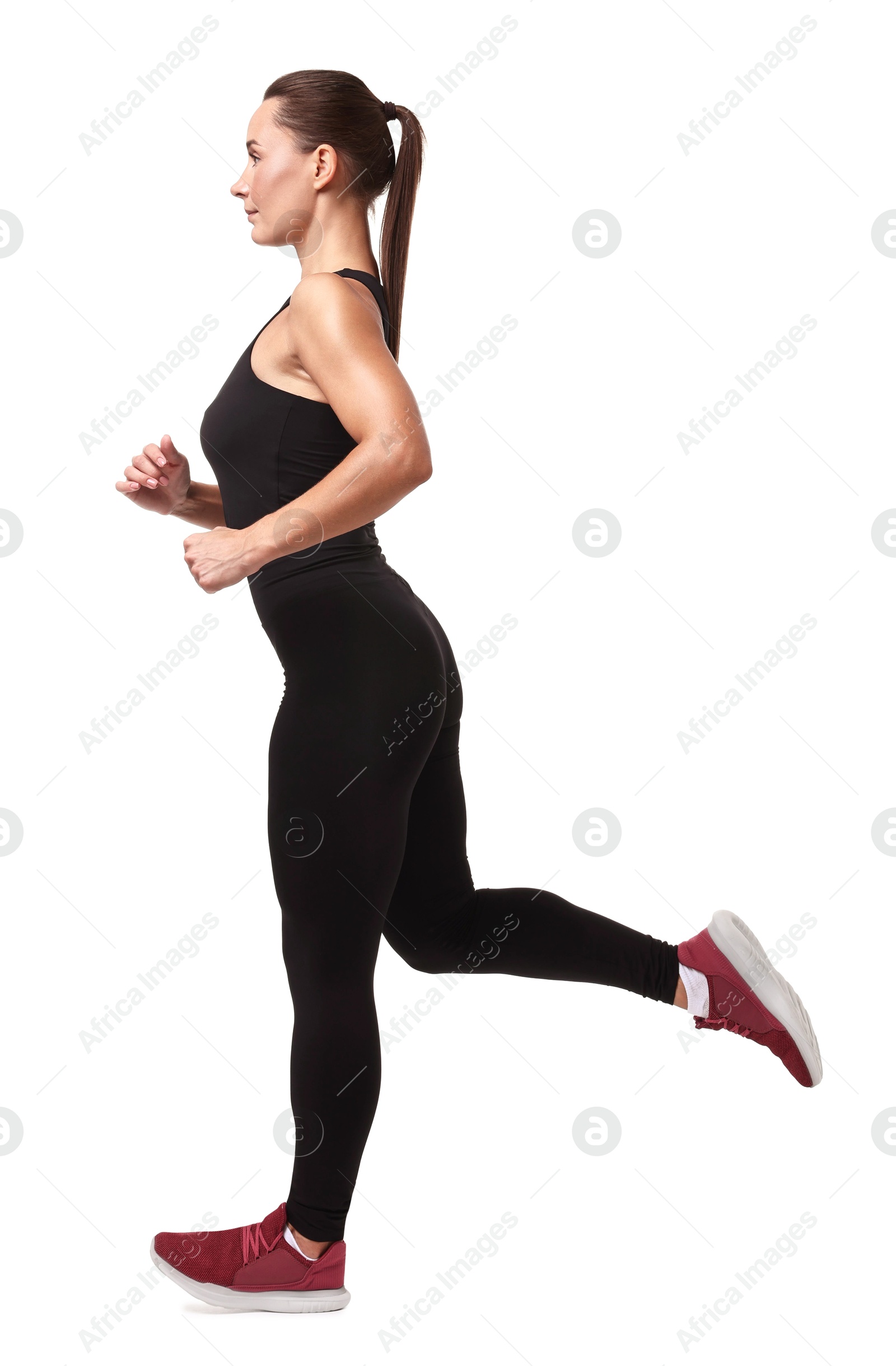 Photo of Woman in sportswear running on white background