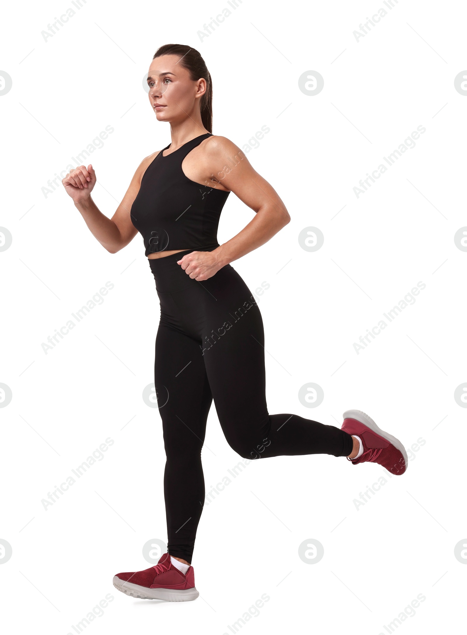 Photo of Woman in sportswear running on white background