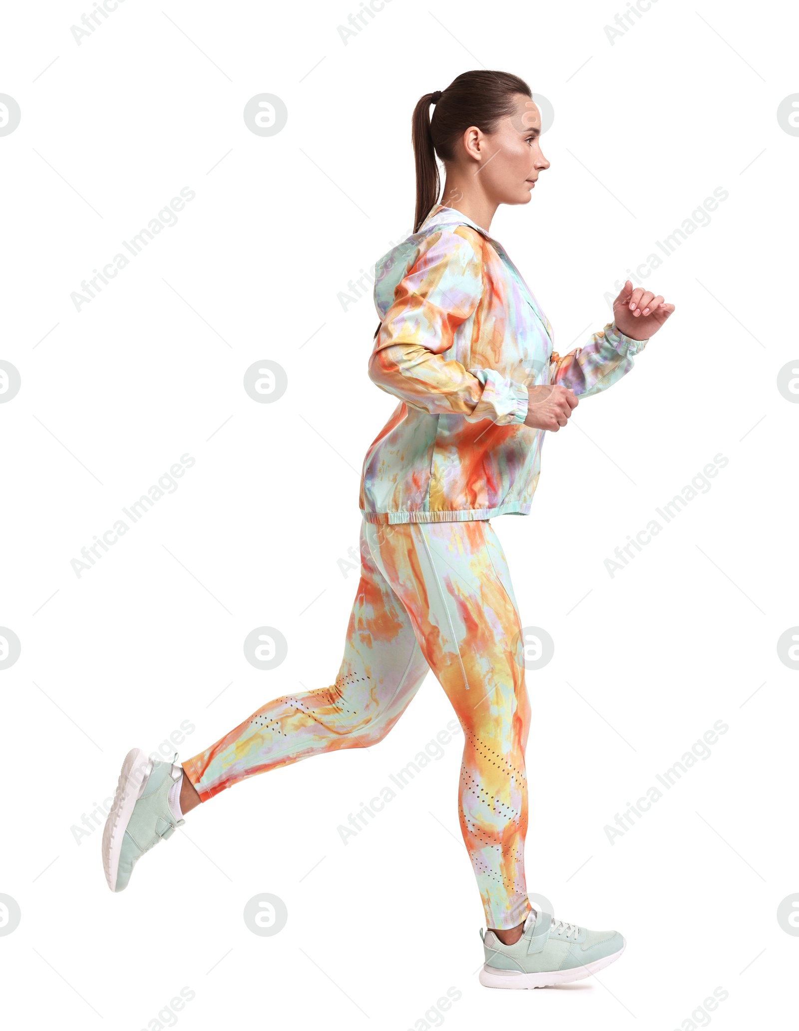 Photo of Woman in sportswear running on white background