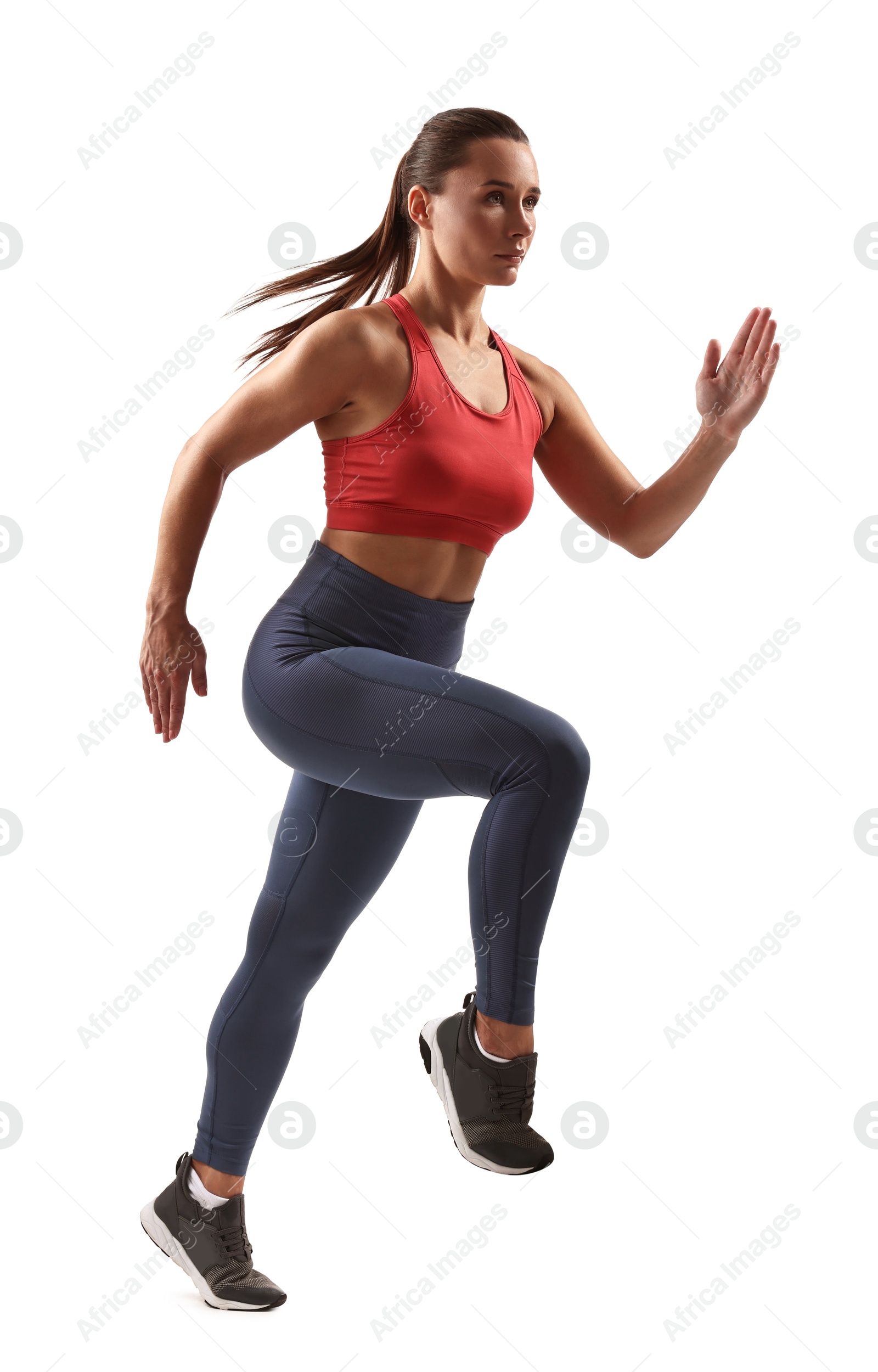 Photo of Woman in sportswear running on white background