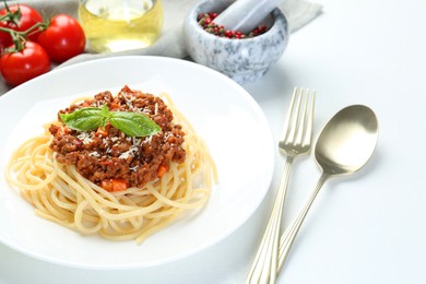 Photo of Delicious pasta bolognese served on white table