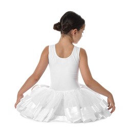 Little ballerina sitting on white background, back view