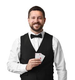 Professional croupier with playing cards on white background