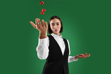 Croupier with dice and casino chips on green background