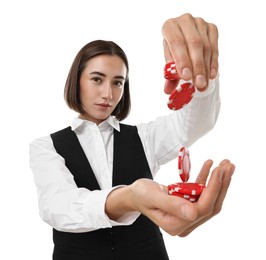 Professional croupier with casino chips on white background