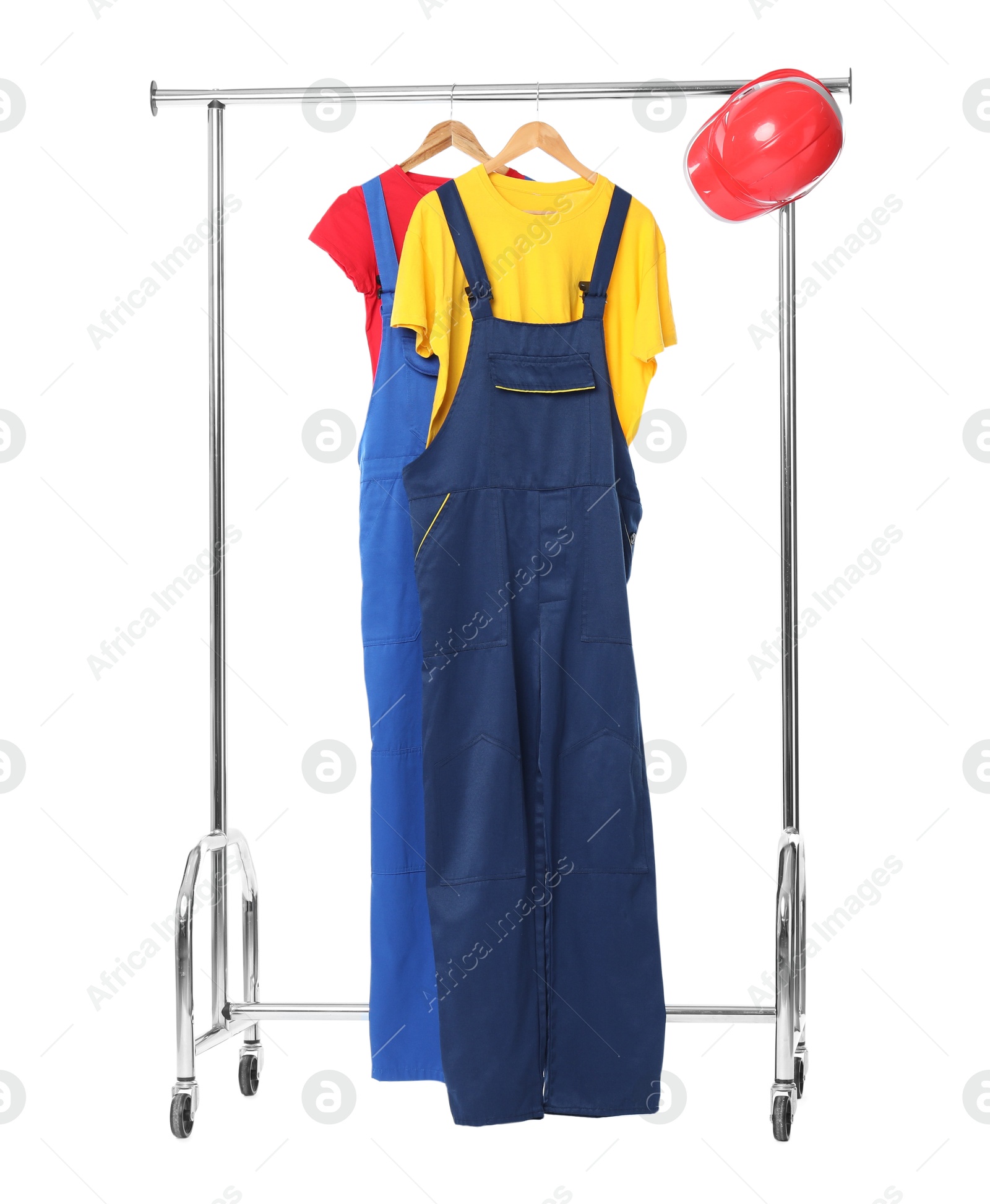 Photo of Workers' uniforms on clothing rack isolated on white