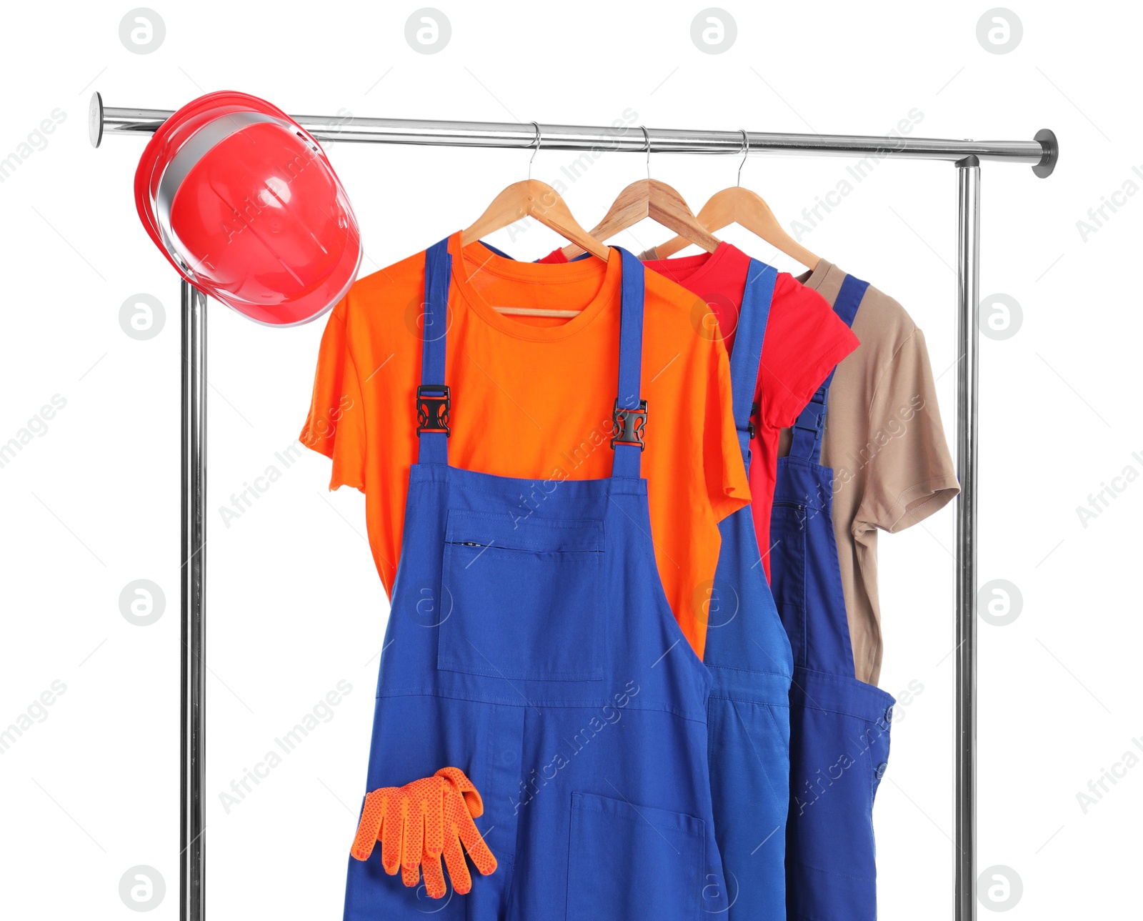 Photo of Workers' uniforms on clothing rack isolated on white