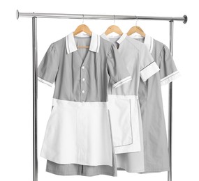 Photo of Maids' uniforms on clothing rack isolated on white