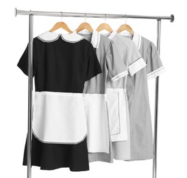 Photo of Maids' uniforms on clothing rack isolated on white