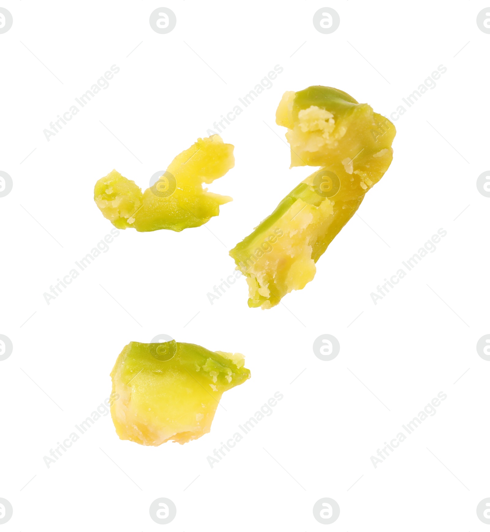 Photo of Pieces of peeled pistachio nut isolated on white