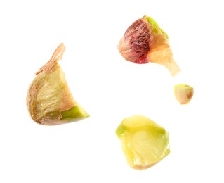 Photo of Pieces of peeled pistachio nut isolated on white