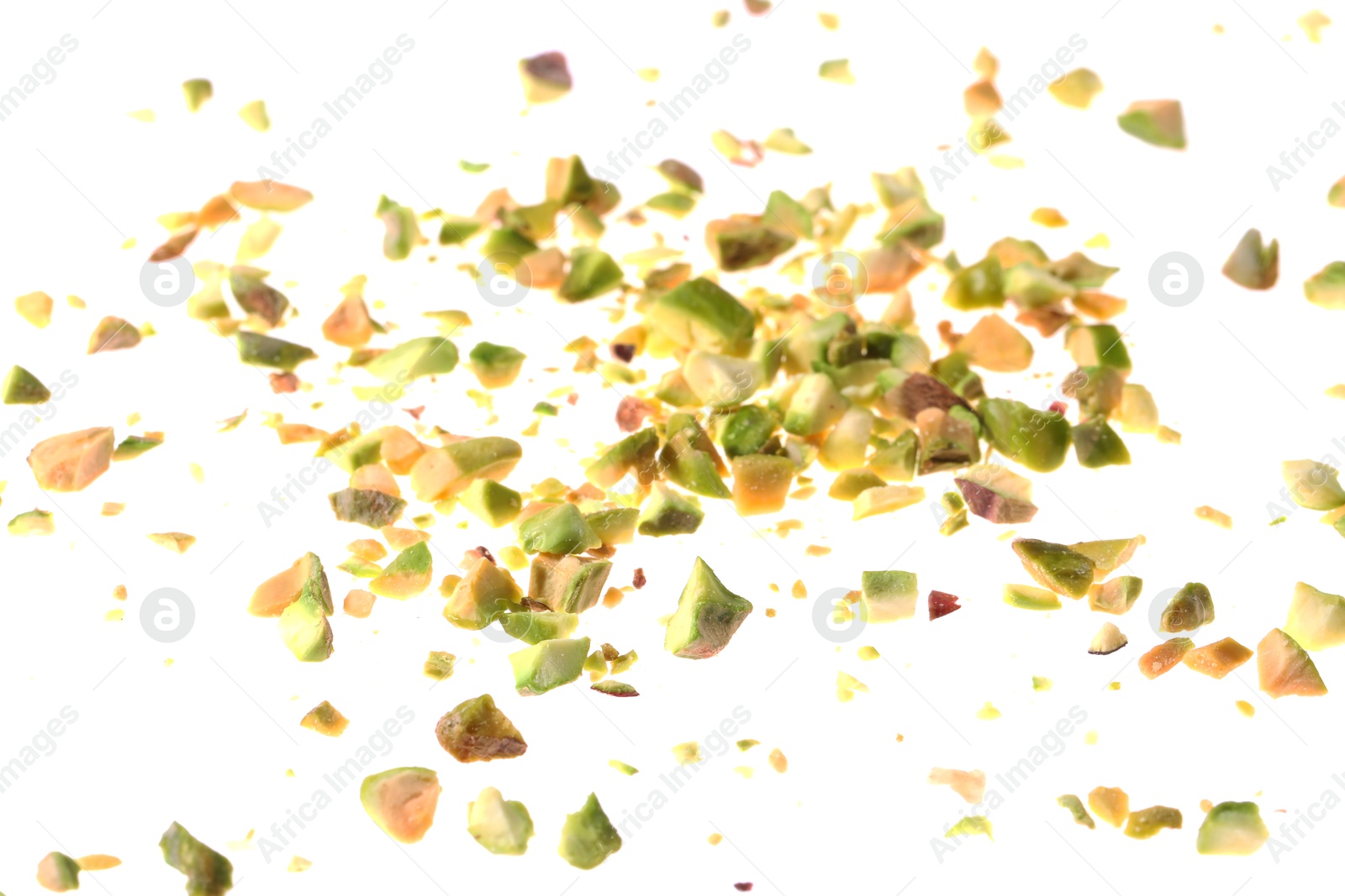 Photo of Pieces of peeled pistachio nut isolated on white