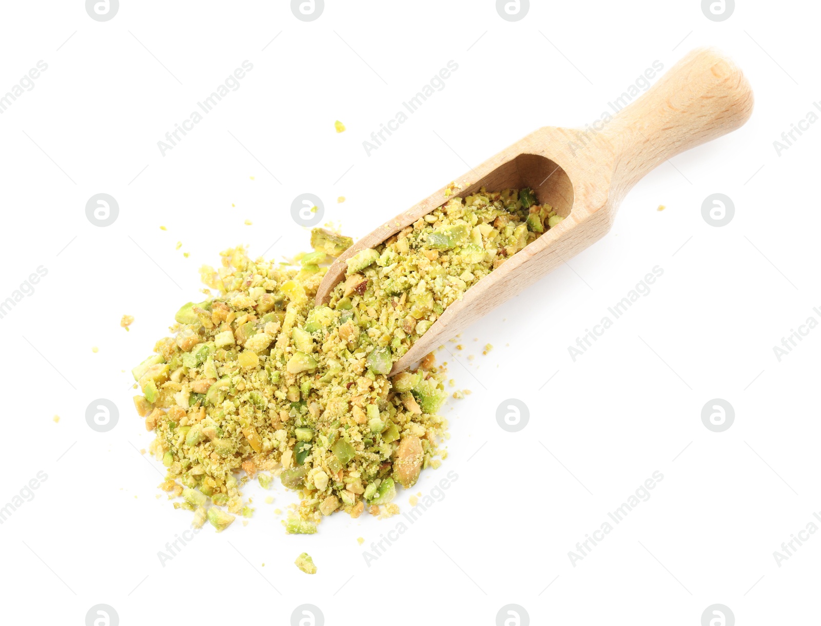 Photo of Pieces of peeled pistachio nut in wooden scoop isolated on white