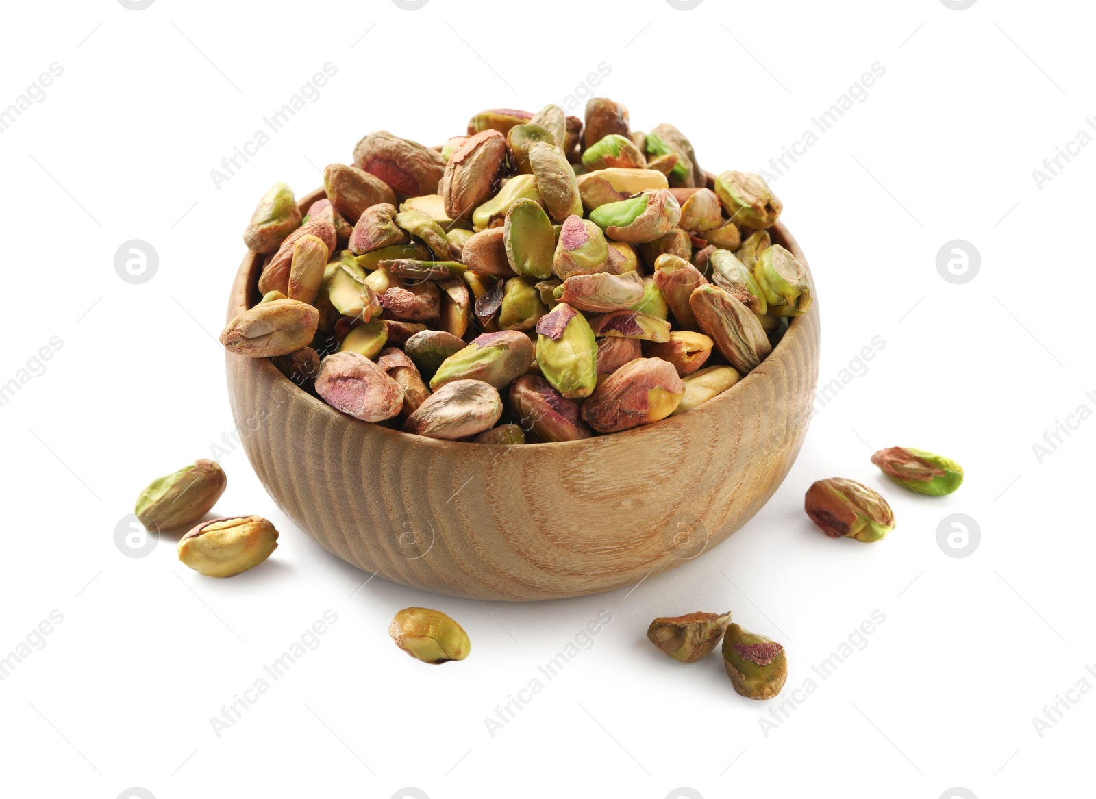 Photo of Peeled pistachio nuts in bowl isolated on white