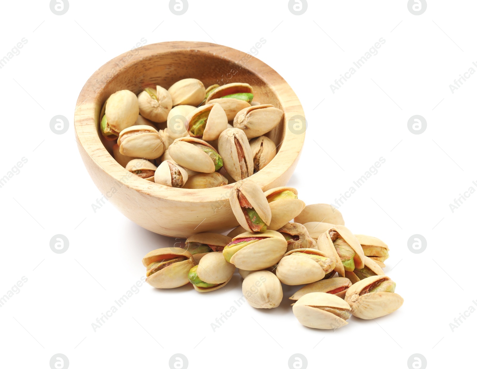 Photo of Tasty pistachio nuts in bowl isolated on white